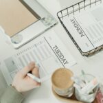 person writing on a paper